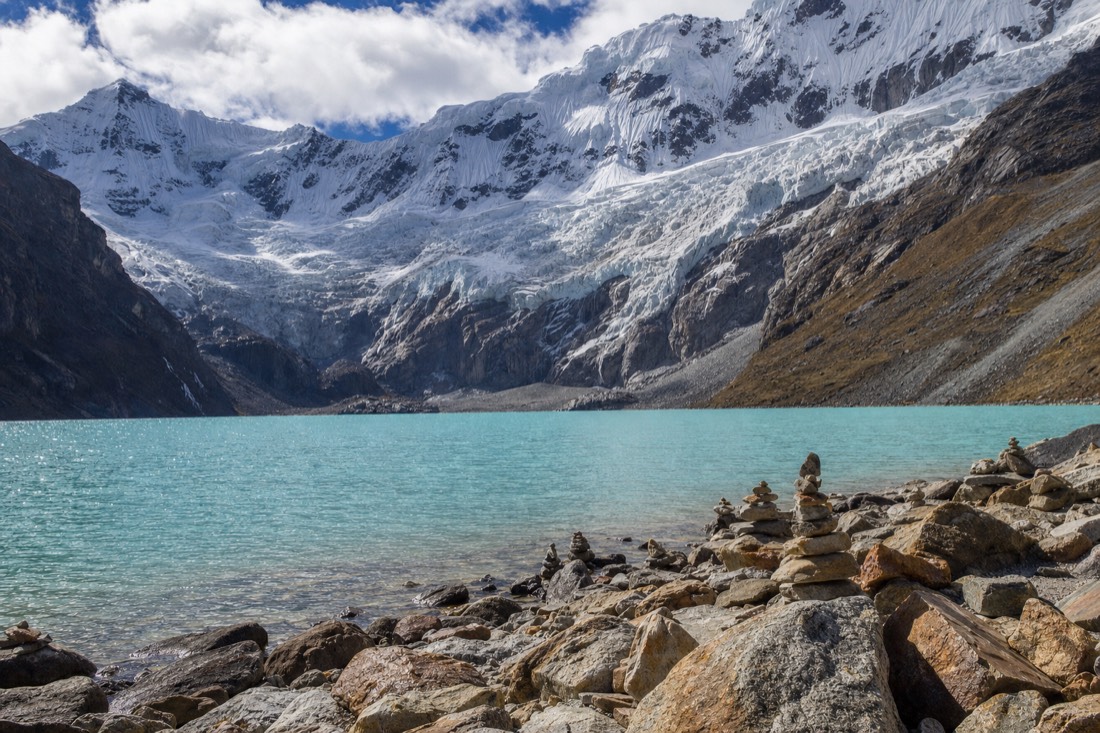 The glacier-fed turquoise shore of Humantay Lake at 4,200 m, the destination of the day tour from Cusco
